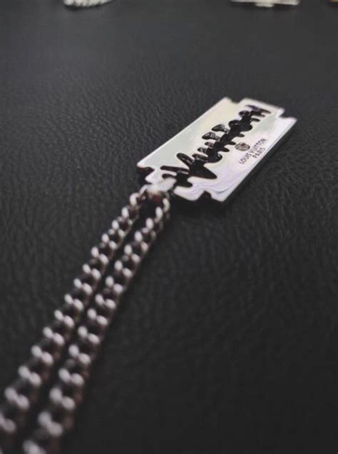 louis vuitton razor blade necklace.